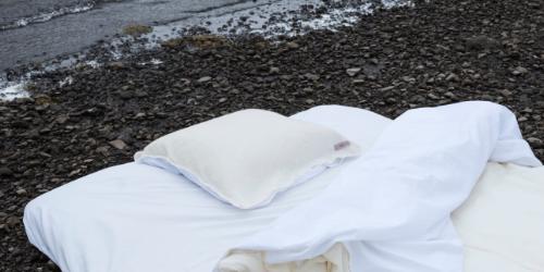 image of bedding on a rocky beach